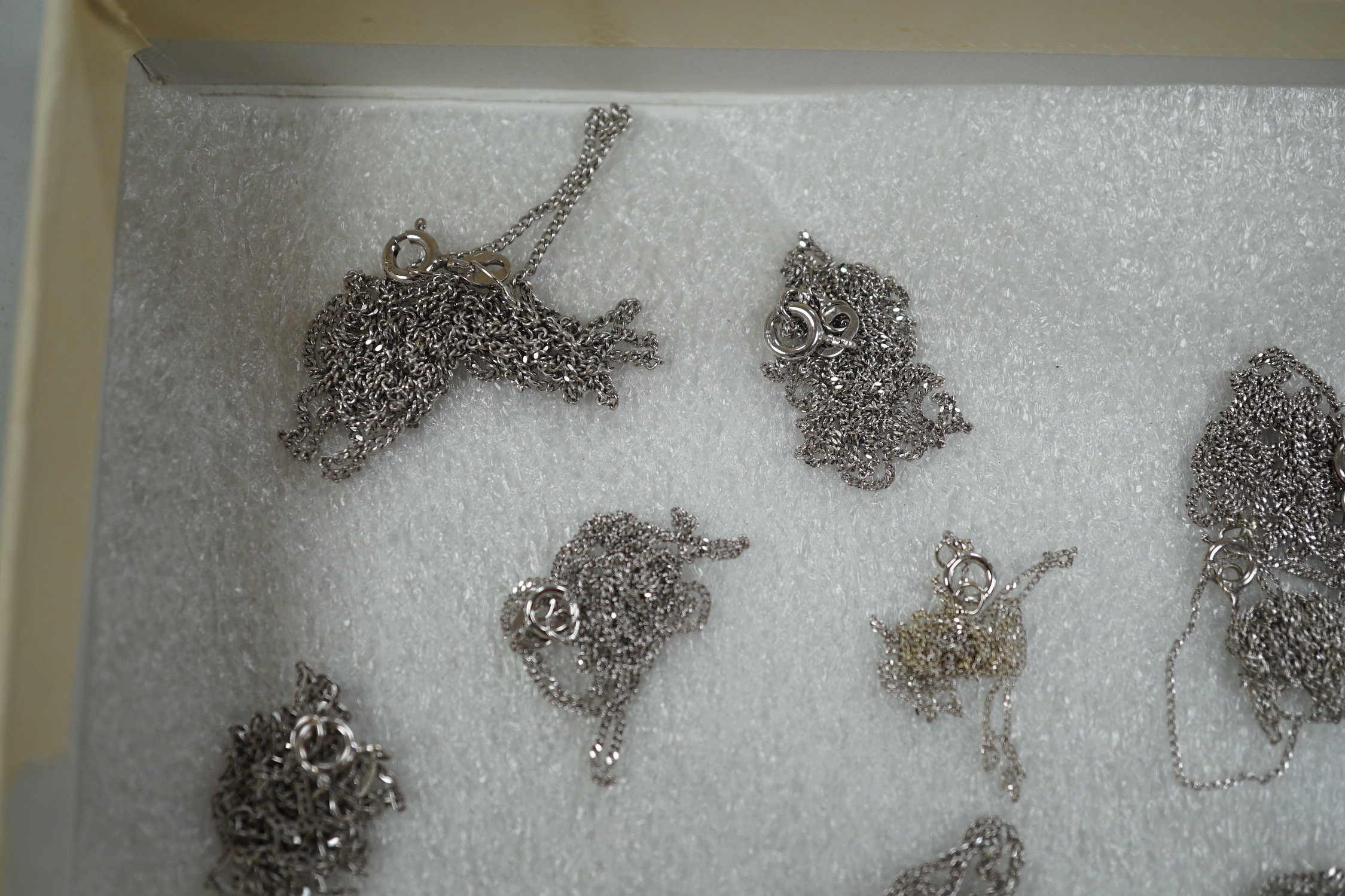 Thirteen assorted modern 375 white metal chains, longest 60cm, shortest 40cm, (one a.f.). 19.2 grams.